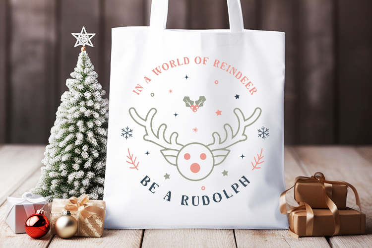 In a World of Reindeer Be a Rudolph - Boho Christmas SVG Tote Bag Mockup Image.jpg