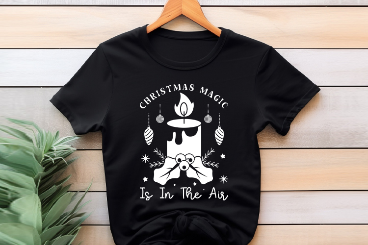 Boho Christmas Magic is in the Air SVG Cut File Shirt Mockup Image.jpg